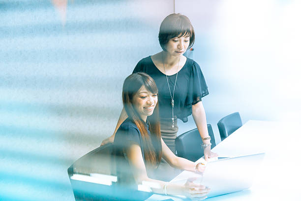 istock japanese women working with laptop 540104046