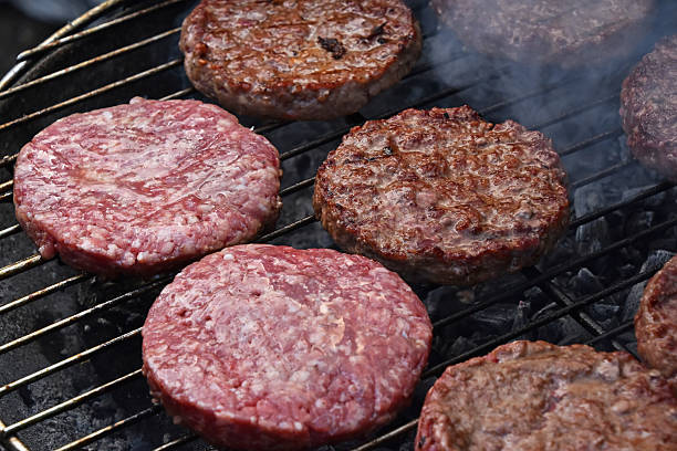 istock Meat burgers for hamburger on smoke grill 540104070