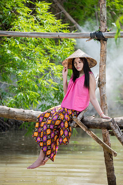 istock Young woman is sitting on wooden bridge . 540106178