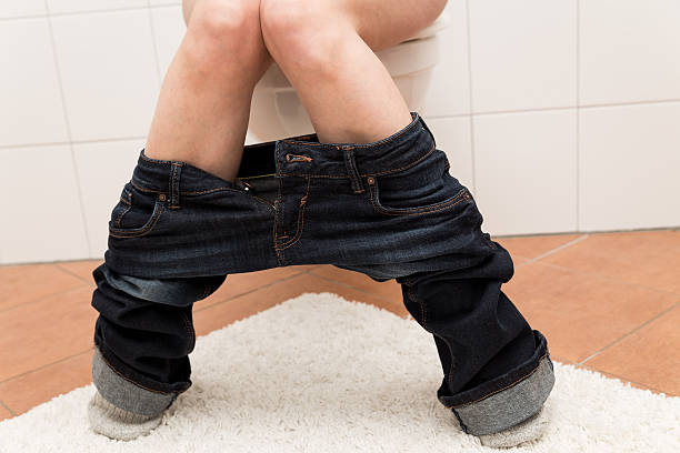 istock woman on the toilett is suffering about congestion 540107352