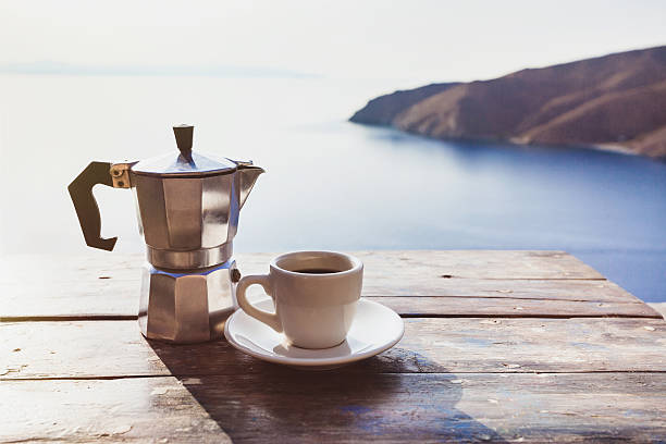 istock Cup of coffee on a table with beautiful sea view 540108602