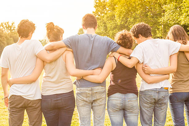 istock group of teenagers walking together 540110146