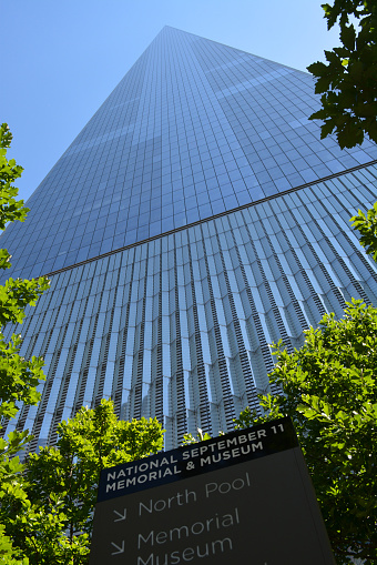 New York, USA - June 11, 2017: Looking up at the landmark World Trade Center Tower One at Ground Zero in New York City in 2016.