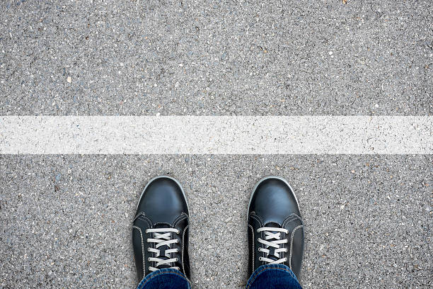 istock Black casual shoes standing at the white line 540115768