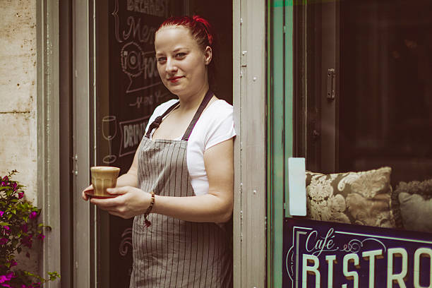 istock Young barista is standing at the coffee shop's entry 540116240