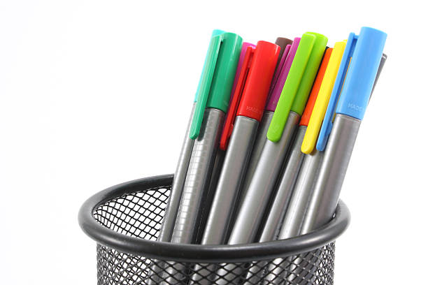 istock Colored markers in basket on the white background 540116362