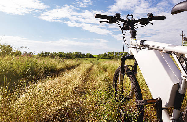 Electric bicycle parked on agricultural field on a sunny day