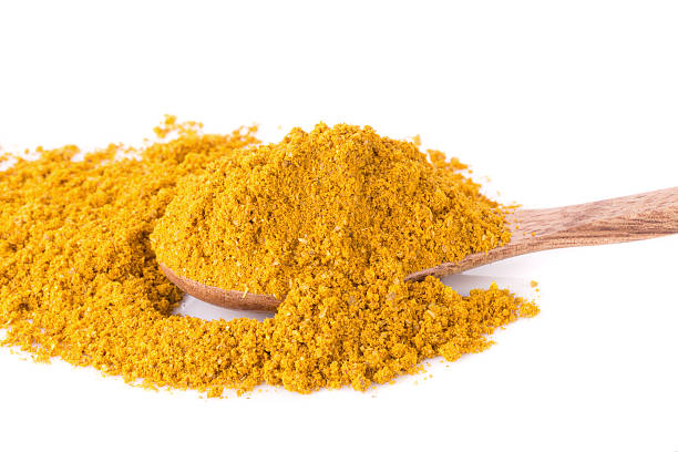 istock Heap of curry powder, closeup, isolated on white background. 540118516