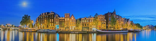 istock Amstel river, canals and night view of Amsterdam, Netherlands. 540119220
