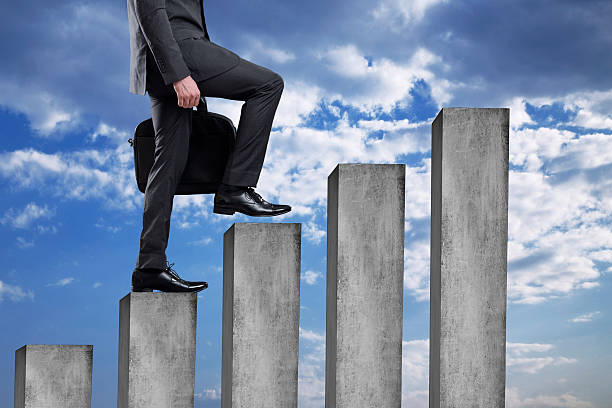 istock Businessman walking up on bar graph 540121210