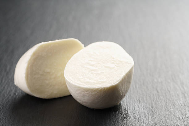istock sliced mozarella ball on slate background 540121404