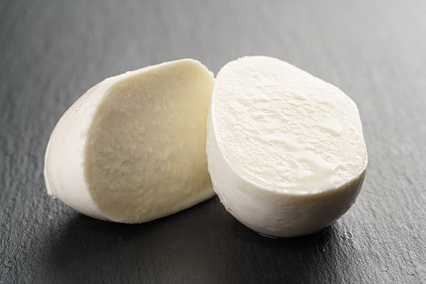 istock sliced mozarella ball on slate background 540121526