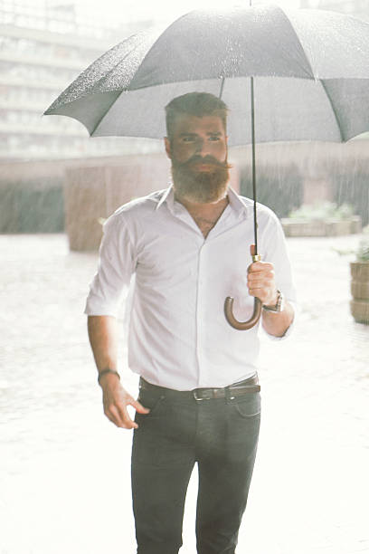 istock Businessman With Umbrella In The Rain 540122112