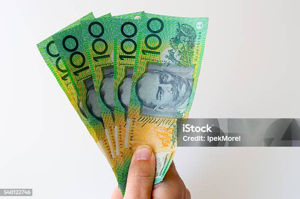 Man Holding Five Hundred Australian Dollar Banknote In His Hands Stock Photo - Download Image Now