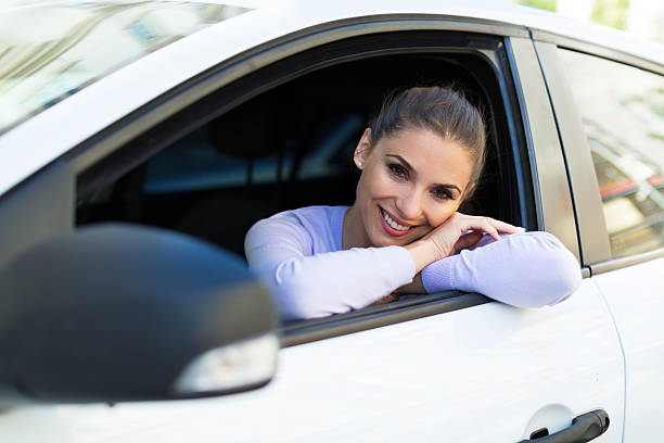 istock Young woman sitting in a car 540122990