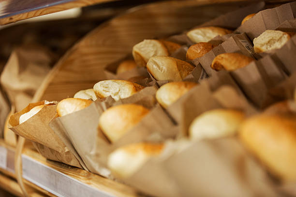 At the bakery. Shelf with loaves of white bread