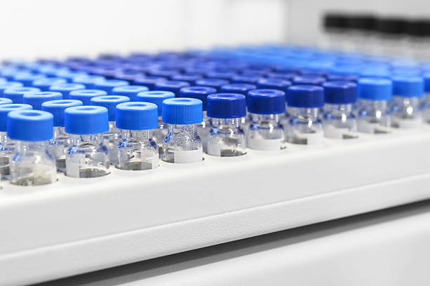 istock Rows of glass vials in the tray automatic liquid dispenser. 540123182