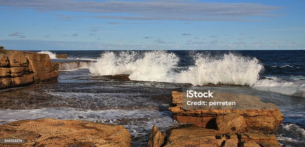 Splashing waves at Maroubra Beach, Sydney Coastal scene in Sydney. Rocks and splashing waves at Maroubra Beach. Australasia Stock Photo