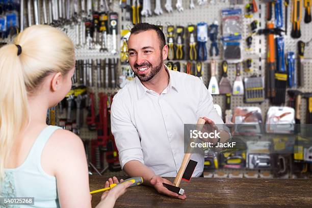 Ïcustomer Getting Help At Pay Desk Stock Photo - Download Image Now - Store, Retail Clerk, Market Vendor