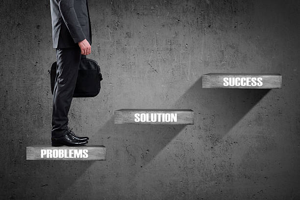 istock Businessman standing on staircase 540125664