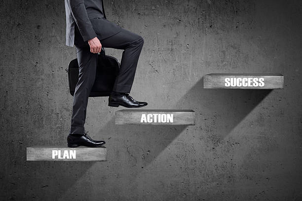 istock Businessman walking up staircase 540126528