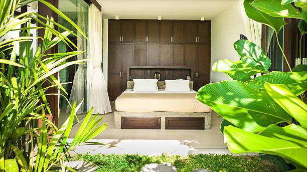 istock Modern bedroom with two pillows cover with a glass 540130554