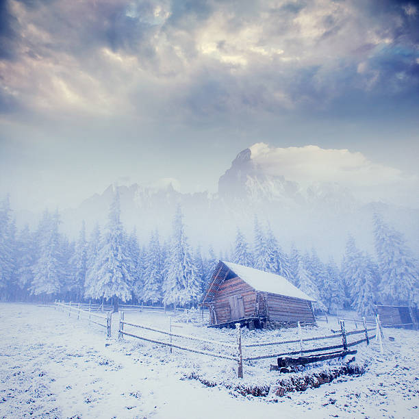 istock cabin in the mountains in winter 540132298