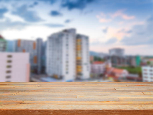 istock Empty wooden table and cityscape background 540195200