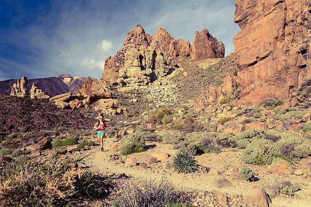 istock Young woman trail running in mountains on summer day 540201738