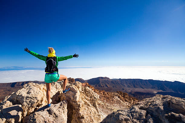 istock Woman climbing success in mountain top 540202538