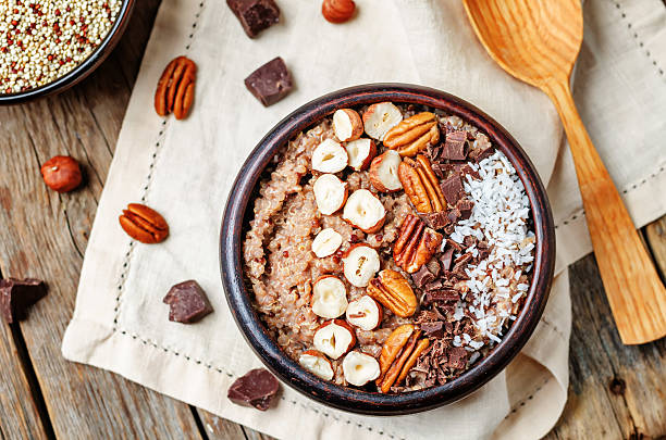 istock Chocolate Quinoa breakfast bowl decorated with hazelnuts, Pecan, chocolate and coconut 540202672