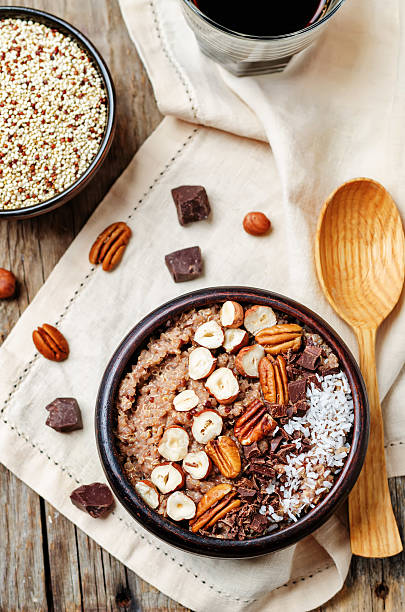 istock Chocolate Quinoa breakfast bowl decorated with hazelnuts, Pecan, chocolate and coconut 540202680