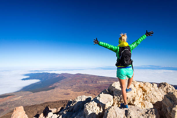 istock Woman climbing success in mountain top 540202736