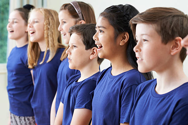 istock Group Of School Children Singing In Choir Together 540202828