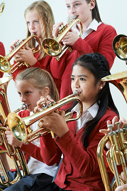 istock Group Of Students Playing In School Orchestra Together 540203154
