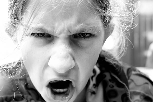 istock Rebellious teenager screams. Evil and furious. 540203416