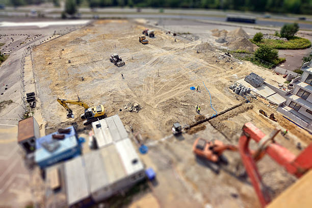 istock Workers, Engineers digging in ground, sewer system, excavation vehicle, tilt-shift 540204666