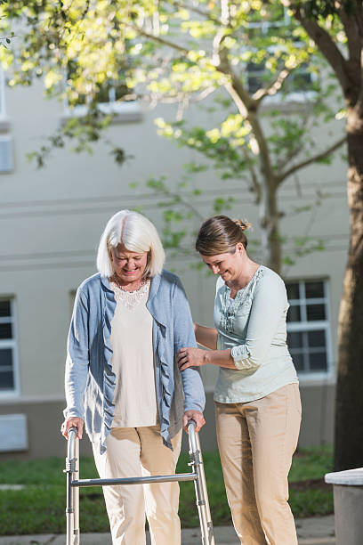 istock Women using walker, with adult daughter 540206940