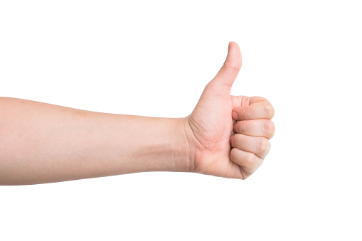 male hand showing thumbs up isolated on white