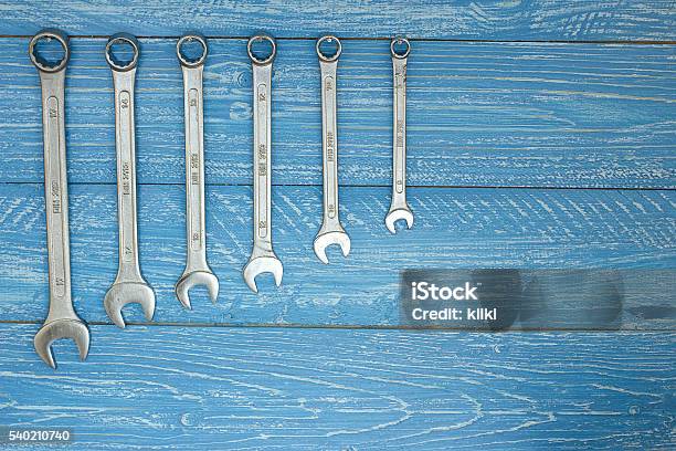 Set Of Wrenches Hanging On A Wooden Board Stock Photo - Download Image Now - Accessibility, Backgrounds, Blue