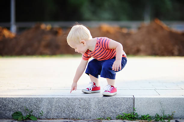 istock Toddler boy playing outdoors 540211274