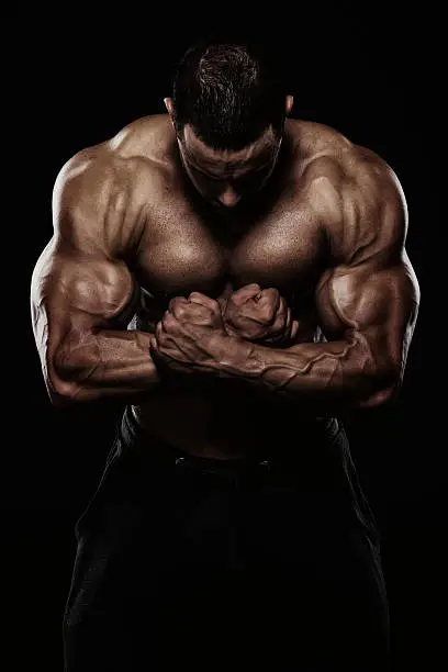 Close Up Of Muscular Men Flexing Muscles