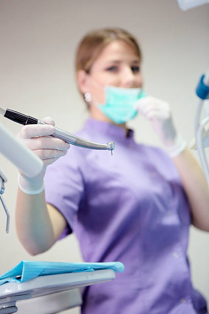 istock Young female dentist doing the dental exam 540216052