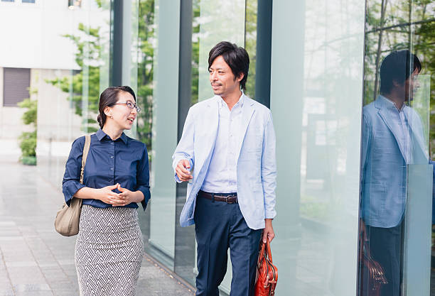 istock Japanese Business People Walking Outside on a Work Break 540216586