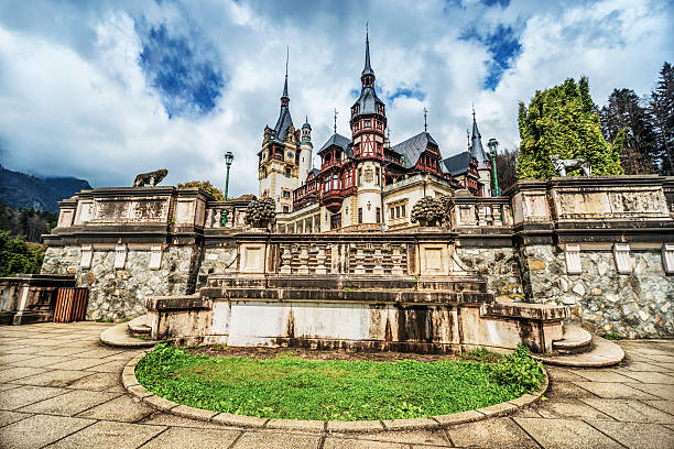 Sinaia, Romania - April 19, 2014: The Peles Castle, a Neo-Renaissance castle in the Carpathian Mountains, near Sinaia, Romania. It served as a royal summer retreat. It was built between 1873 and 1914. for King Carol I of Romania. Its inauguration was held in 1883.