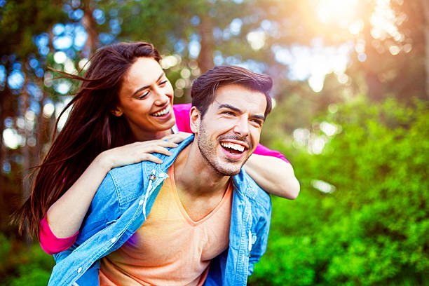 istock Happy romantic couple piggyback 540219112