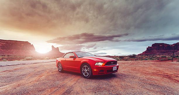 Monument Valley, United States - June 6, 2015: Photo of a Ford Mustang Convertible 2012 version at Monument Valley,Utah, USA. The fifth generation began with the 2005 model year to 2014.