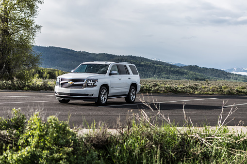 Yellowstone, United States - June 2, 2015: Photo of a Chevrolet Tahoe LTZ at Yellowstone national park,Wyoming, USA. The Tahoe was Motor Trend magazine's Truck of the Year for 1996. It is named for Lake Tahoe on the California-Nevada border in the United States.