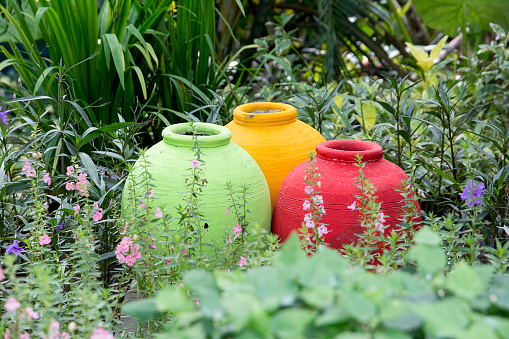Three colorful jar in the garden,Decorative jar