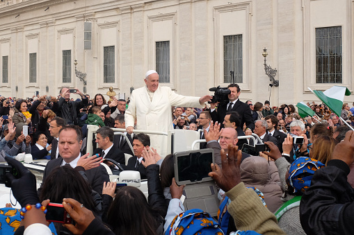 Vatican  City - October 29, 2014: Pope Francis greets attendees at the weekly general audience on October 29, 2014 in Rome. Every week, thousands of pilgrims from around the world take this opportunity to meet the Pontifex.